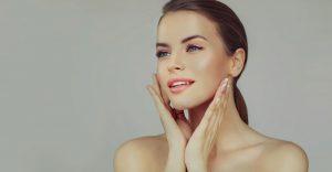woman touching her face after a professional facial waxing