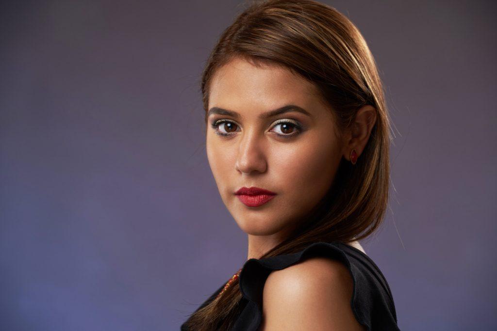 salon client with sleek hair after a keratin treatment in Denver