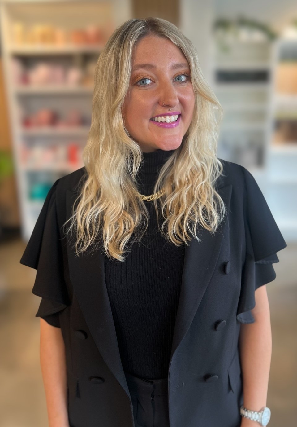 Hairstylist Lilly Lanter at Deseo Salon Denver, specializing in creative color, balayage, precision cuts, and unique styles.