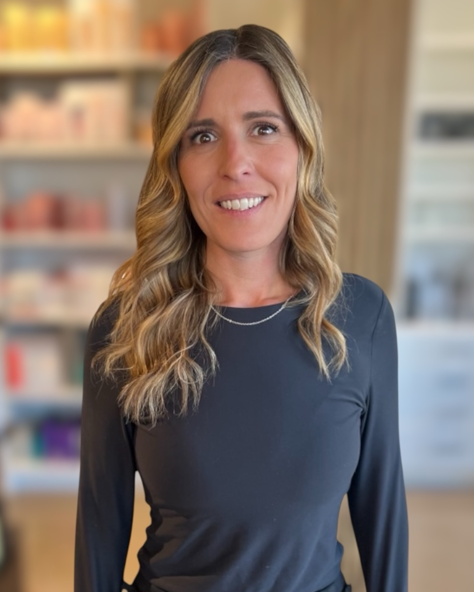 Katie Whitney, Denver hair stylist specializing in custom blonding and hair extensions at Deseo Salon & BlowDry