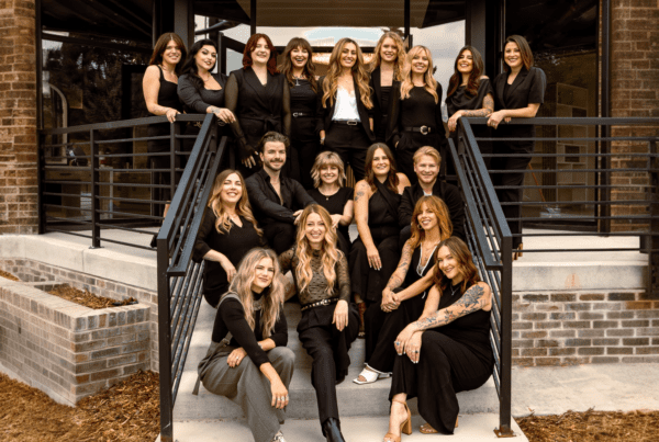 The smiling hairstylist team at Deseo Salon and BlowDry, a luxury hair salon in the Highlands and Sloan's Lake neighborhood of Denver Colorado