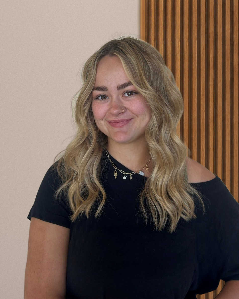 Lexi Hansen, hairstylist at Deseo Salon & BlowDry in Denver, a blonding specialist known for effortless blondes, lived-in color, balayage, and hair extensions